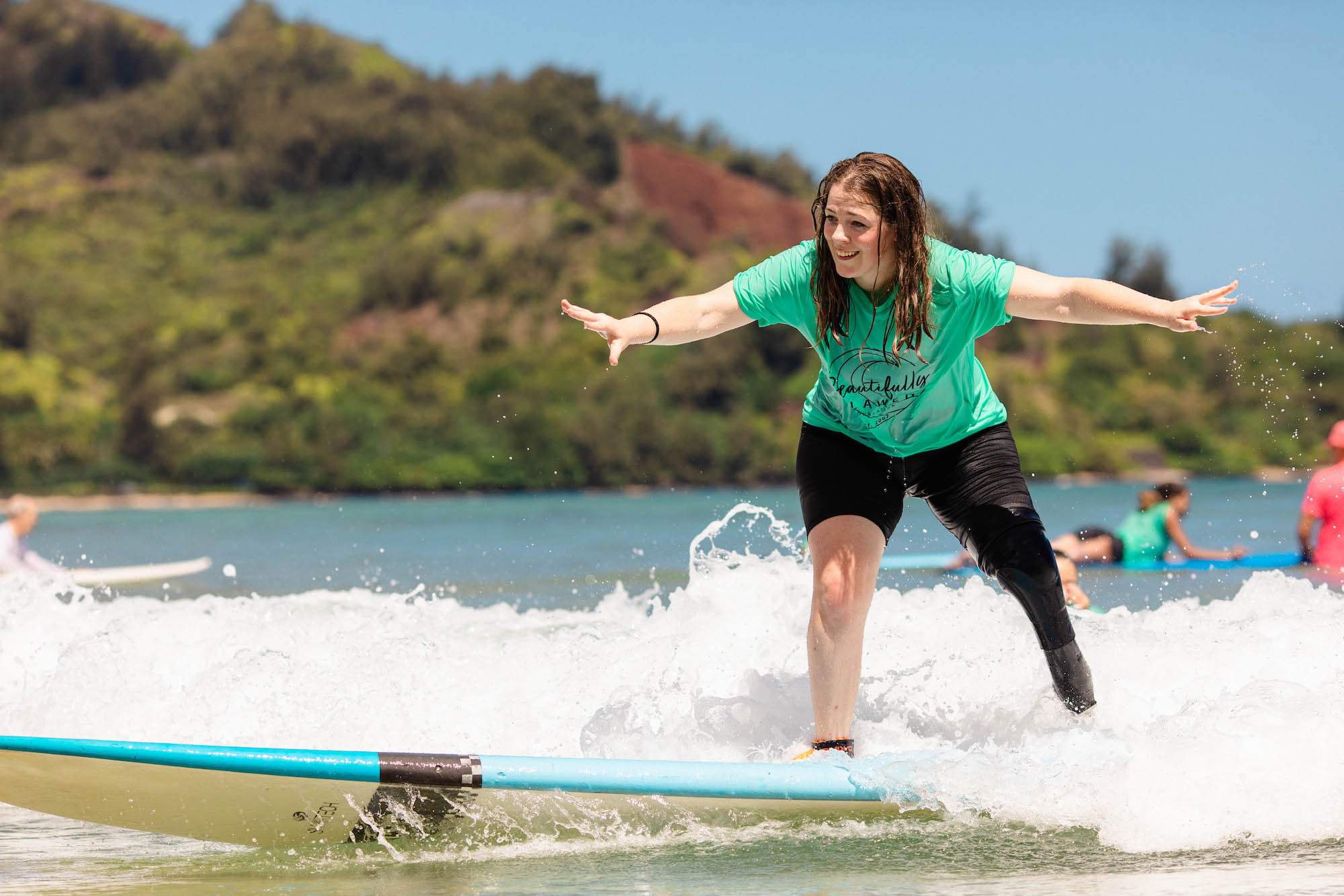 Leg amputee Laura surfing
