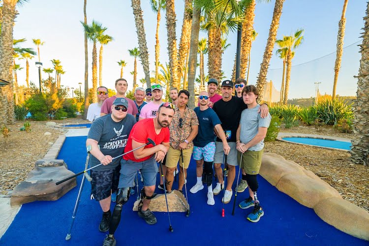 Group photo of the Forge retreat men at a mini golf course in Del Mar, California.