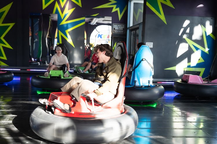 The Forge retreat men enjoy riding bumper cars at Belmont Park in San Diego.