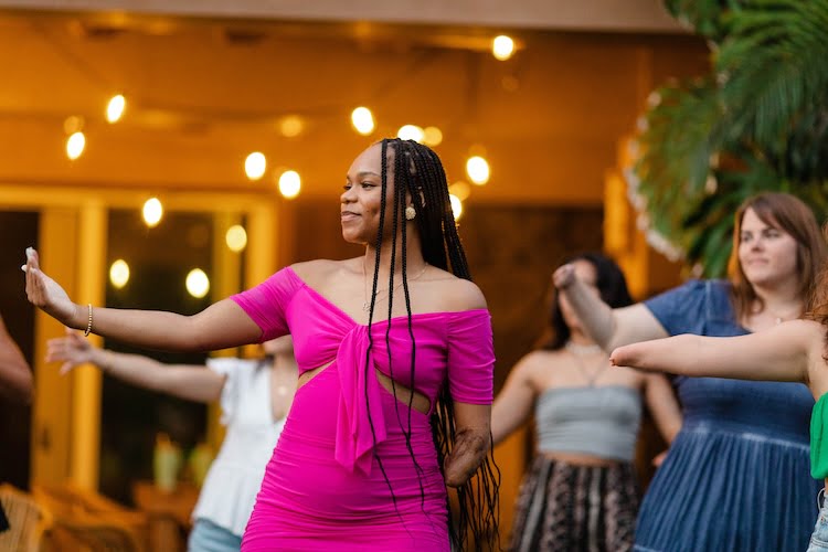 Beautifully Flawed attendee learns how to hula dance during the Kauai retreat.