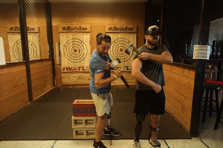 The Forge men go axe throwing putting their aiming and adapting skills to use.