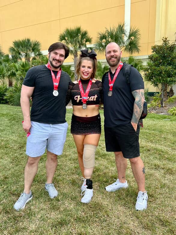 Brooke Walker with friends wearing medals around their neck